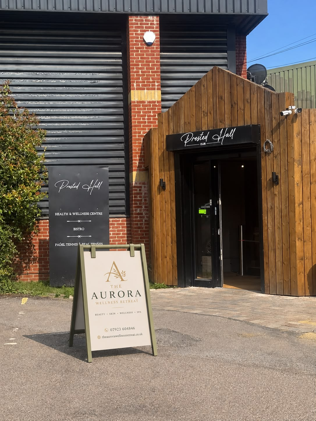 The Aurora Wellness Retreat sign outside the entrance
